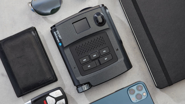 Escort Maxcam 360c top down view on countertop with gadgets